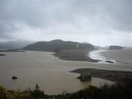 The Russian river empties into the ocean in a flood of red mud